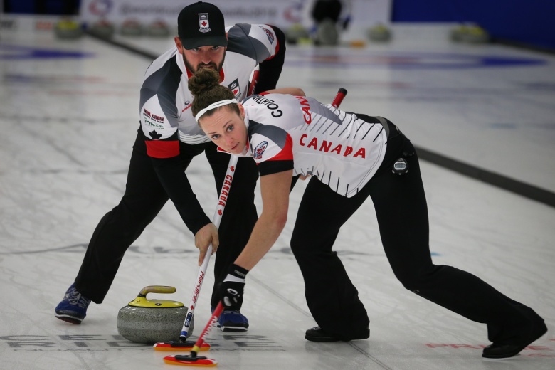 Team canada playing doubles curling